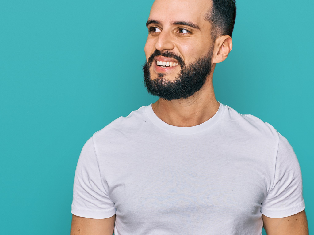Bearded man with white tshirt smiling
